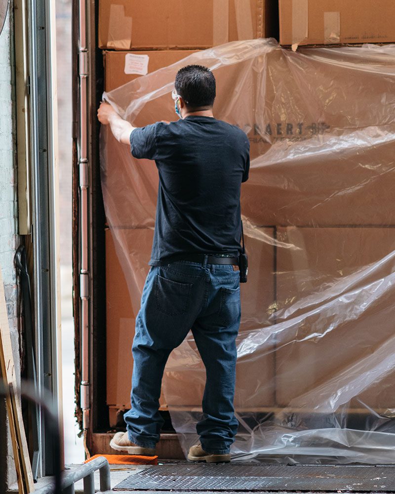 man wrapping shipment